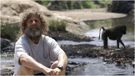 Dr. Robert Sapolsky in Field with Baboon